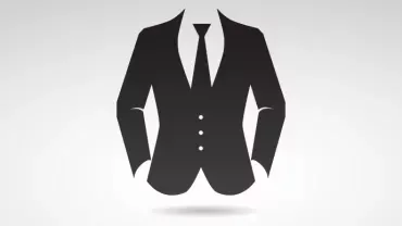 Silhouette of a black suit and tie on a light background.