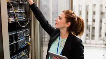 Woman checking technical equipment