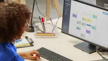 woman checking her 4-day workweek calendar