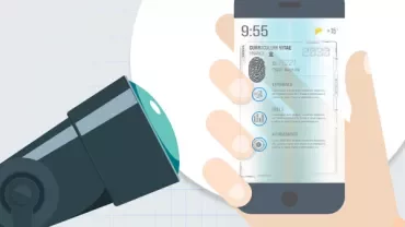 Hand holding a smartphone displaying a digital résumé with a camera nearby.