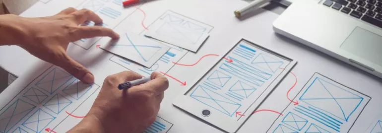 Two hands drawing graphs