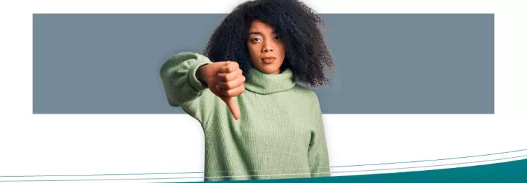 Person showing a thumbs-down gesture.