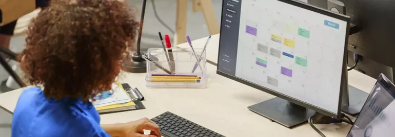 woman checking her 4-day workweek calendar
