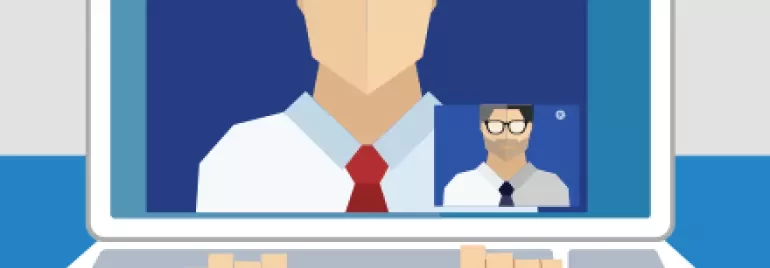 Laptop screen showing video call with two people in a meeting.