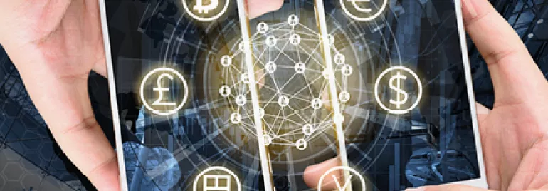 Two smartphones with currency symbols, representing digital transactions.