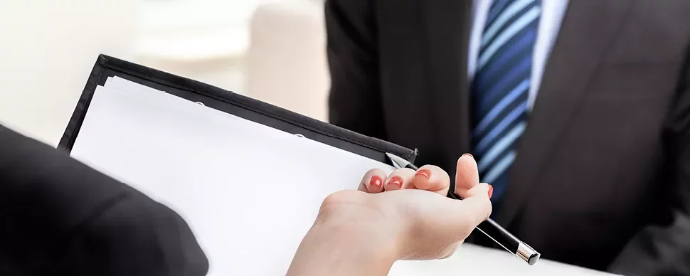 Interview setting with a clipboard and pen.